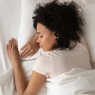 woman sleeping peacefully in bed bug free bed