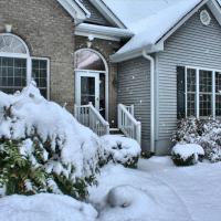 house in winter covered in snow